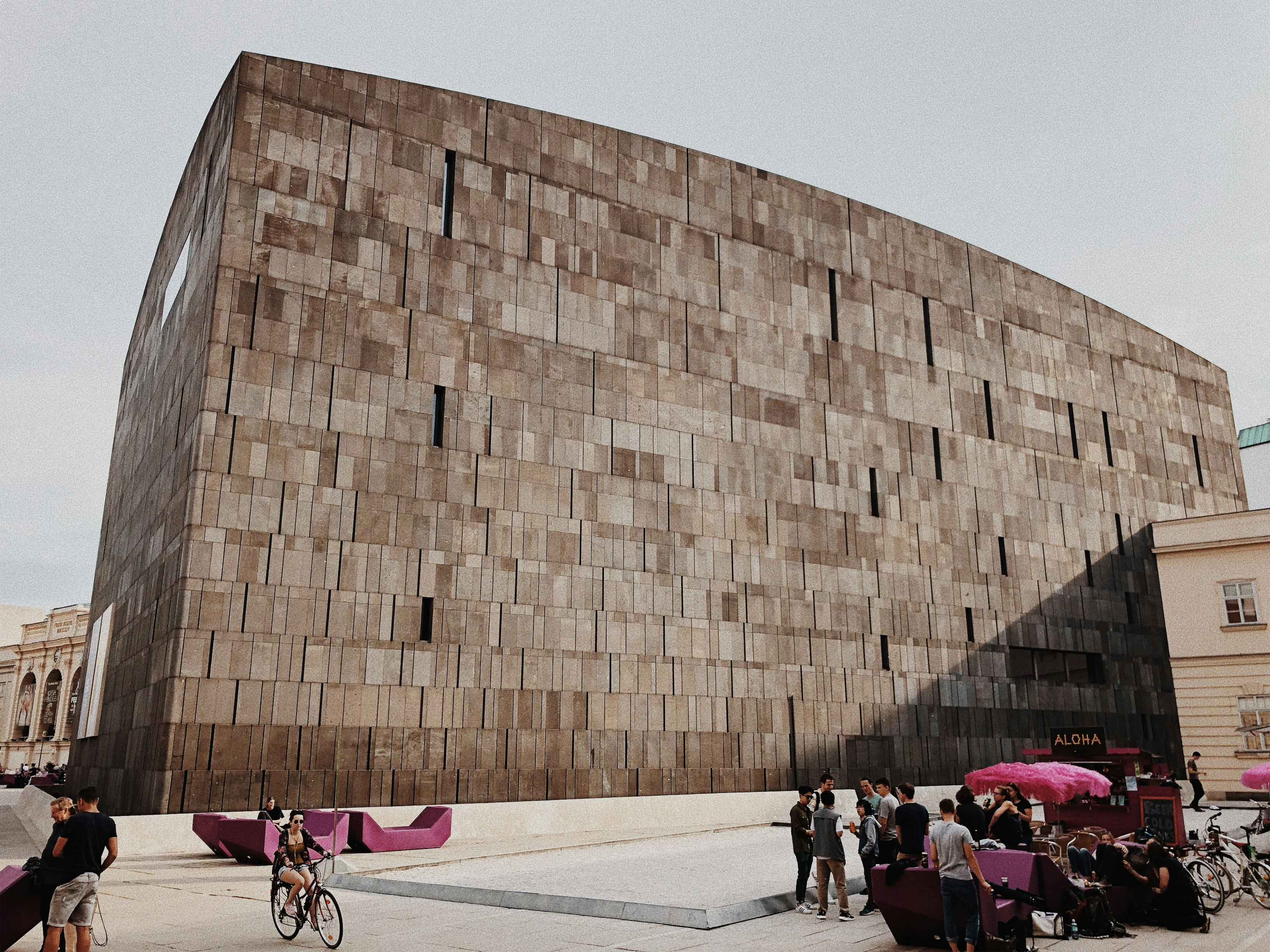 people walking and biking near building